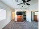 Main bedroom with large mirrored closet and ceiling fan at 3205 Mystic Ridge Ct, Las Vegas, NV 89129