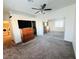 Main bedroom with mirrored closet doors and ceiling fan at 3205 Mystic Ridge Ct, Las Vegas, NV 89129