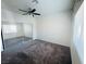 Main bedroom with mirrored closet doors and ceiling fan at 3205 Mystic Ridge Ct, Las Vegas, NV 89129