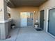 Private patio with sliding glass doors and space for plants at 3205 Mystic Ridge Ct, Las Vegas, NV 89129