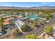 Aerial view of The Lakes neighborhood, showcasing commercial areas and tranquil lake surroundings at 3305 Cutty Sark St, Las Vegas, NV 89117