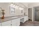 Bathroom with double sink vanity, granite countertops and a separate shower at 3305 Cutty Sark St, Las Vegas, NV 89117