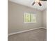 Serene carpeted bedroom featuring a window with blinds and a ceiling fan for added comfort at 3305 Cutty Sark St, Las Vegas, NV 89117