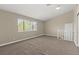 Cozy carpeted bedroom with a large window offering plenty of natural light and exterior views at 3305 Cutty Sark St, Las Vegas, NV 89117