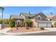 Charming two-story home featuring a three car garage, desert landscaping, and a welcoming entrance at 3305 Cutty Sark St, Las Vegas, NV 89117