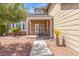 Inviting home entrance with a brick-lined walkway, mature landscaping, and a charming covered porch at 3305 Cutty Sark St, Las Vegas, NV 89117