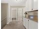 Hallway featuring neutral colors and plush carpeting, and granite countertops at 3305 Cutty Sark St, Las Vegas, NV 89117