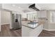 Kitchen with stainless steel appliances, granite countertops, and white cabinets at 3305 Cutty Sark St, Las Vegas, NV 89117