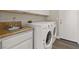 Laundry room with washer, dryer and granite countertop at 3305 Cutty Sark St, Las Vegas, NV 89117