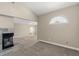 Carpeted living room with fireplace and an arched transom window at 3305 Cutty Sark St, Las Vegas, NV 89117