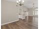 Bright living room features wood floors, neutral colors, and access to the kitchen and stairs at 3305 Cutty Sark St, Las Vegas, NV 89117