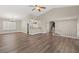 Open living room showcasing a split-level floor plan and hardwood floors at 3305 Cutty Sark St, Las Vegas, NV 89117