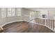 Open living area with wood floors, plantation shutters, and a brick fireplace at 3305 Cutty Sark St, Las Vegas, NV 89117