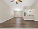 Bright living room features wood floors, neutral colors, and access to the kitchen and stairs at 3305 Cutty Sark St, Las Vegas, NV 89117