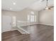 Bright living room with vaulted ceilings, wood floors, plantation shutters, and a ceiling fan at 3305 Cutty Sark St, Las Vegas, NV 89117