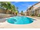 Refreshing backyard pool with a tanning ledge offers the perfect space for outdoor entertainment at 3305 Cutty Sark St, Las Vegas, NV 89117