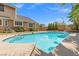 Inviting pool with stairs in backyard, ideal for relaxation and enjoying sunny days in a serene setting at 3305 Cutty Sark St, Las Vegas, NV 89117