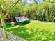 Relaxing backyard with a hanging chair and artificial turf at 3398 El Camino Real, Las Vegas, NV 89121