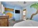 Bedroom with mural, dresser, and view into adjacent room at 3398 El Camino Real, Las Vegas, NV 89121