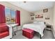 Bedroom with red accents, a bed, and Parisian-themed art at 3398 El Camino Real, Las Vegas, NV 89121