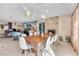 Large dining area with a wooden table and white chairs at 3398 El Camino Real, Las Vegas, NV 89121