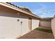 House exterior with a storage room and artificial turf at 3398 El Camino Real, Las Vegas, NV 89121