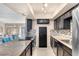 Modern kitchen with stainless steel appliances and tile backsplash at 3398 El Camino Real, Las Vegas, NV 89121