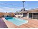 Inviting kidney-shaped pool with patio and lounge chairs at 3398 El Camino Real, Las Vegas, NV 89121