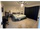 A well-decorated bedroom featuring a fan, painting and plush carpeting at 3625 Winner Dr, Las Vegas, NV 89120