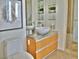 Elegant bathroom with a vessel sink, granite countertop, wooden vanity, and stylish fixtures at 3722 Las Vegas Blvd # 3209, Las Vegas, NV 89158