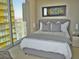 Serene bedroom with a luxurious bed and breathtaking city views through a large window at 3722 Las Vegas Blvd # 3209, Las Vegas, NV 89158