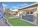 Hot tub, covered patio, and artificial turf at 3757 Grand Viewpoint Ct, Las Vegas, NV 89147