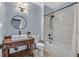 Bathroom with rustic vanity, subway tile shower, and bathtub at 3757 Grand Viewpoint Ct, Las Vegas, NV 89147