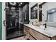 Modern bathroom with double vanity, large shower, and stylish mirrors at 3757 Grand Viewpoint Ct, Las Vegas, NV 89147