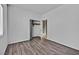 Spacious bedroom with wood-look flooring and a closet at 3757 Grand Viewpoint Ct, Las Vegas, NV 89147