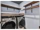 Laundry room with shelving, hanging rods and Samsung washer/dryer at 3757 Grand Viewpoint Ct, Las Vegas, NV 89147