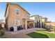 Home back exterior view showing outdoor patio, seating, and landscaping at 3770 S Rosy Carina Pl, Henderson, NV 89052