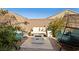 Cozy backyard patio featuring outdoor seating, fire pit, and lush landscaping at 3770 S Rosy Carina Pl, Henderson, NV 89052