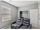 Bedroom featuring two reclining chairs, closet and a window at 3770 S Rosy Carina Pl, Henderson, NV 89052