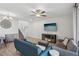 Comfortable living room with stylish furnishings, modern ceiling fan, and neutral paint at 3770 S Rosy Carina Pl, Henderson, NV 89052