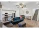 Open-concept floorplan with tile flooring, a modern ceiling fan, and a breakfast bar at 3770 S Rosy Carina Pl, Henderson, NV 89052