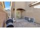 Small backyard with patio, grill, and gravel at 4050 Sparrow Rock St, Las Vegas, NV 89129