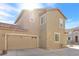 Two story house with attached garage and desert landscaping at 4050 Sparrow Rock St, Las Vegas, NV 89129