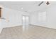 Bright and airy living room with tile floors and a sliding door to the patio at 4050 Sparrow Rock St, Las Vegas, NV 89129