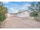 Back exterior showcasing a white siding exterior at 4151 Calimesa St, Las Vegas, NV 89115