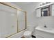 Bathroom with tile floors, standard toilet, and white sink at 4151 Calimesa St, Las Vegas, NV 89115