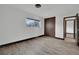 Bedroom with a closet, window view, and wood-look floors at 4151 Calimesa St, Las Vegas, NV 89115