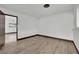 Bedroom featuring wood-look floors, neutral paint, and a modern ceiling fan at 4151 Calimesa St, Las Vegas, NV 89115