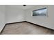 Bedroom showcasing natural light, neutral walls, and wood-look floors at 4151 Calimesa St, Las Vegas, NV 89115