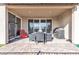 Covered patio featuring stone floors and a barbecue with an outdoor dining set at 4267 E Highvale Ct, Pahrump, NV 89061